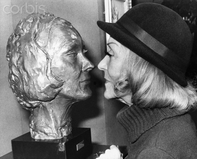 Actress Gloria Swanson Faces a Bust of Herself, 1978